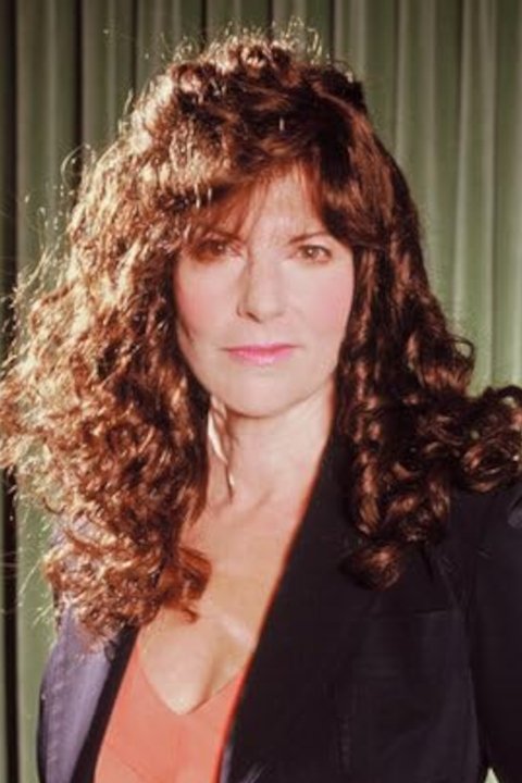 Elaine Corral Kendall - Newscaster (uncredited)
