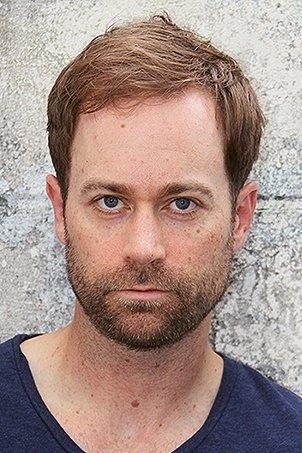Kevin Waterman - Arresting Police Officer (uncredited)