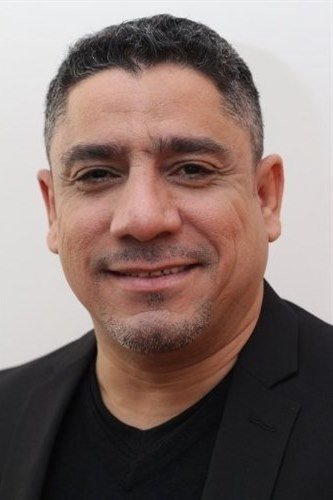 Marcos A. Gonzalez - Arresting Police Officer (uncredited)
