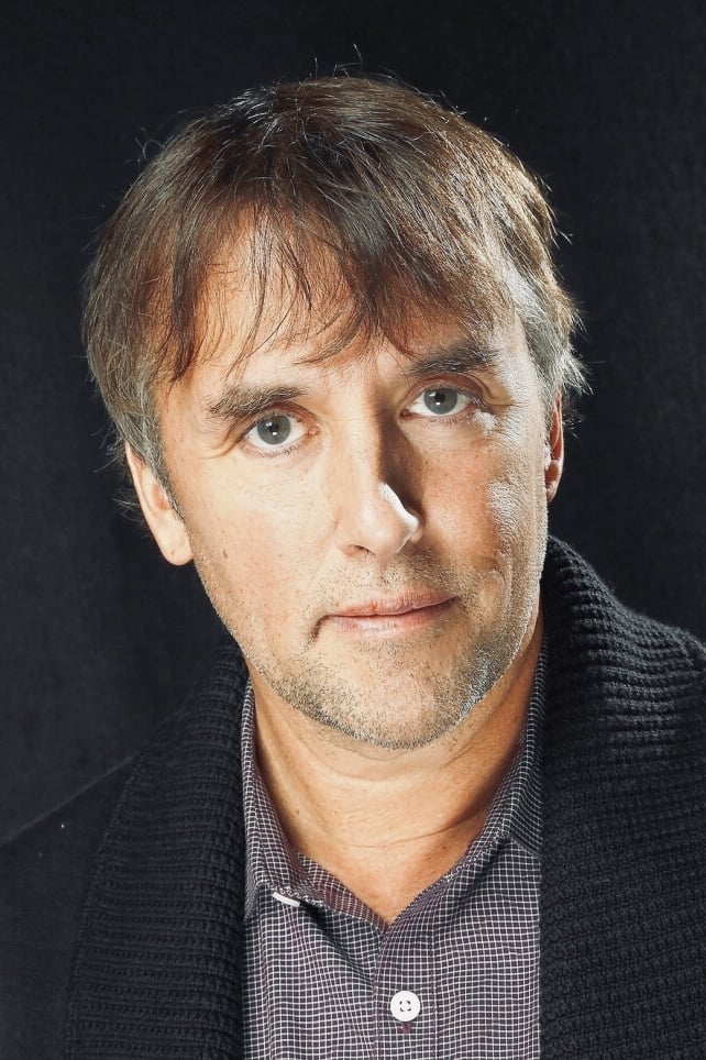 Richard Linklater - Man in Shonen Knife T-Shirt Playing Foosball (uncredited)